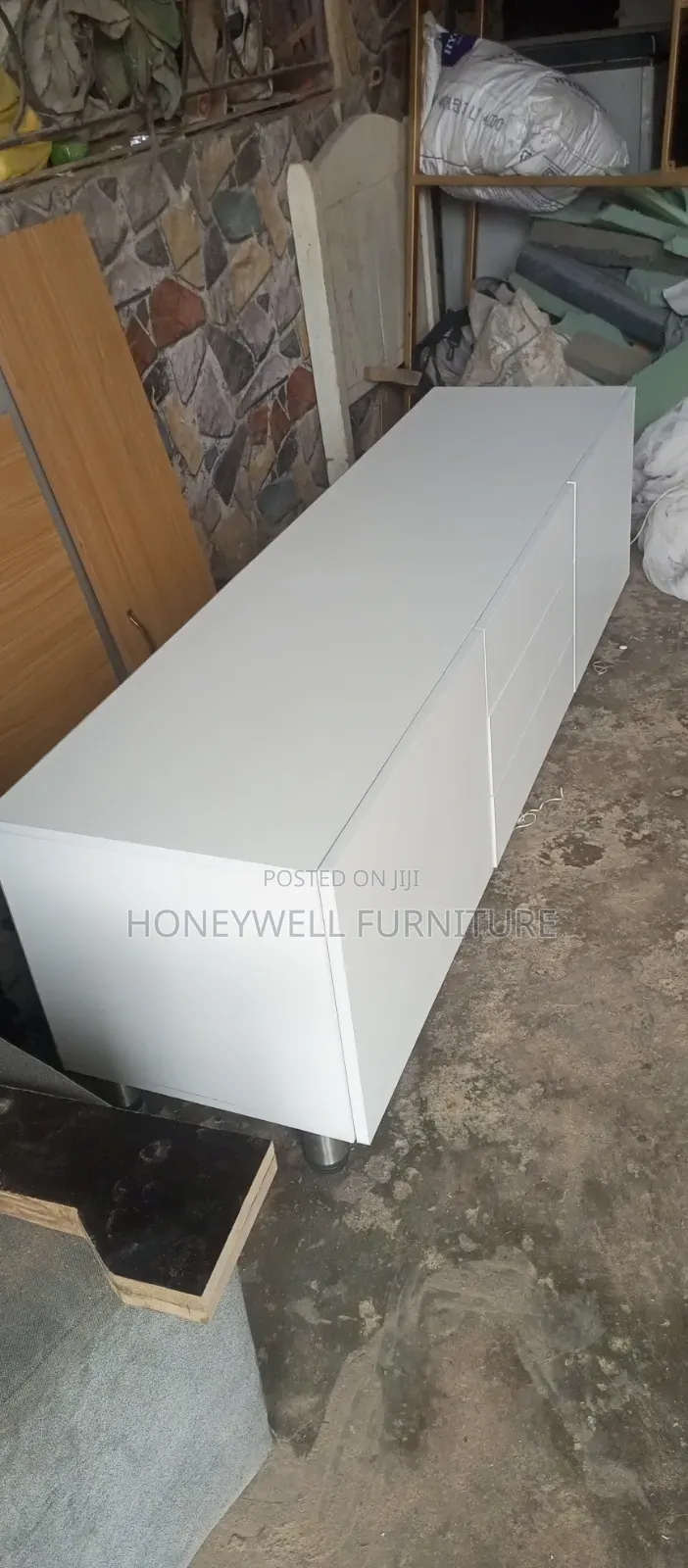 White Tv Console With Three Drawers and Two Doors