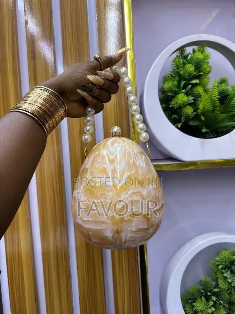 New in Egg Shaped Clutch Bag Available in Black,Gold,White,Etc