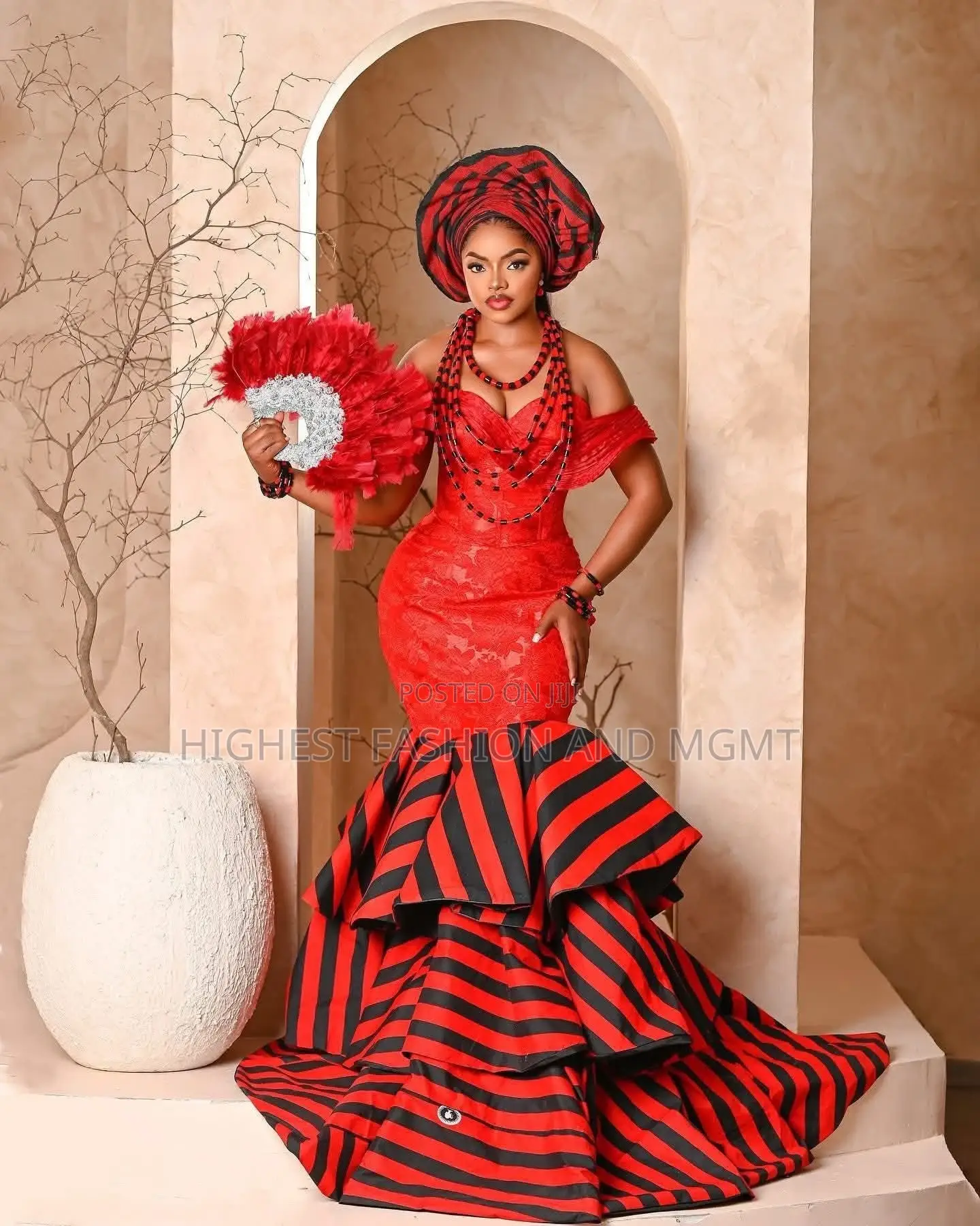 Elite Tiv-Inspired Red and Tiered Mermaid Bridal Gown With Gele