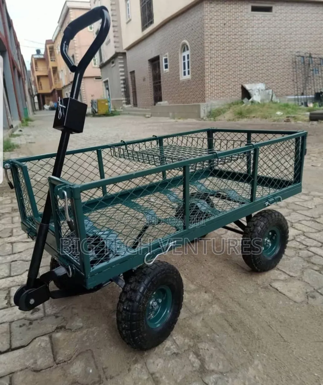 Green Steel Mesh Garden Trolley Features Removable Sides and Pneumatic