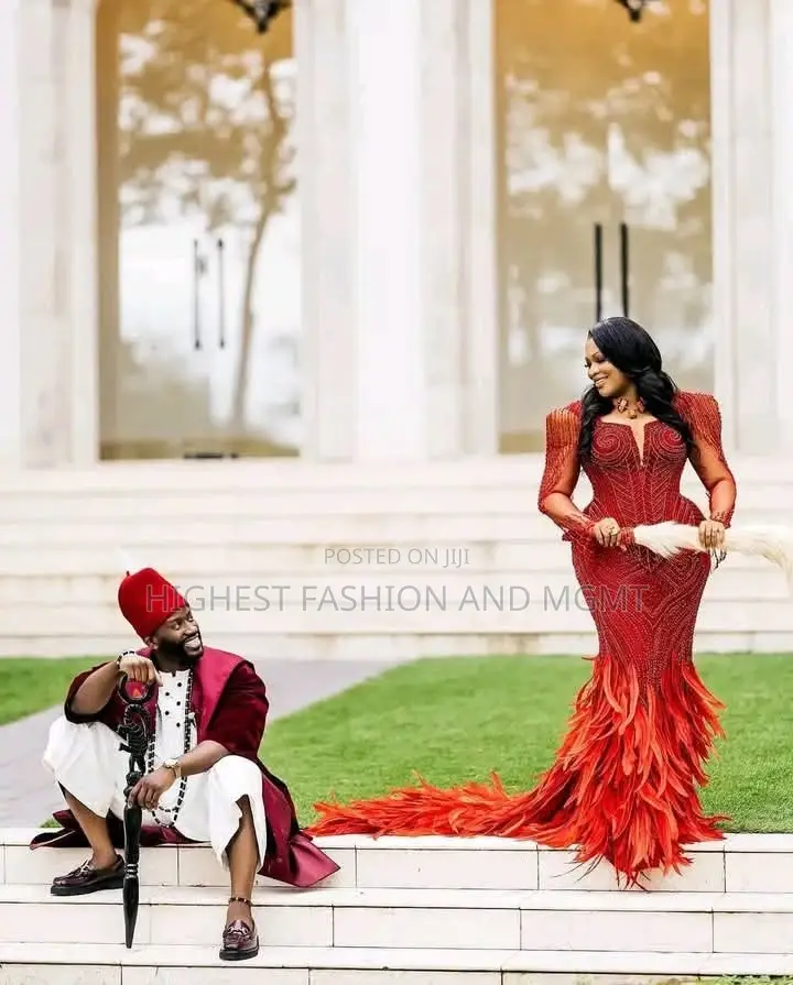 Luxury Coral Beaded Igbo Bridal Gown With Feathers