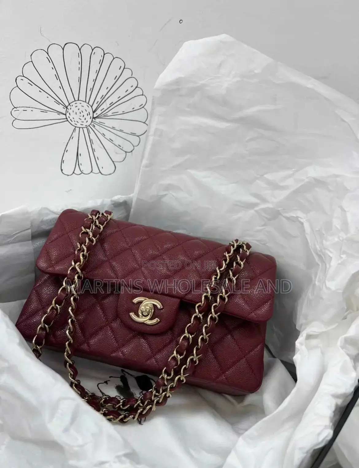 Quilted Burgundy Chanel Flap Bag Featuring a Caviar Leather Texture