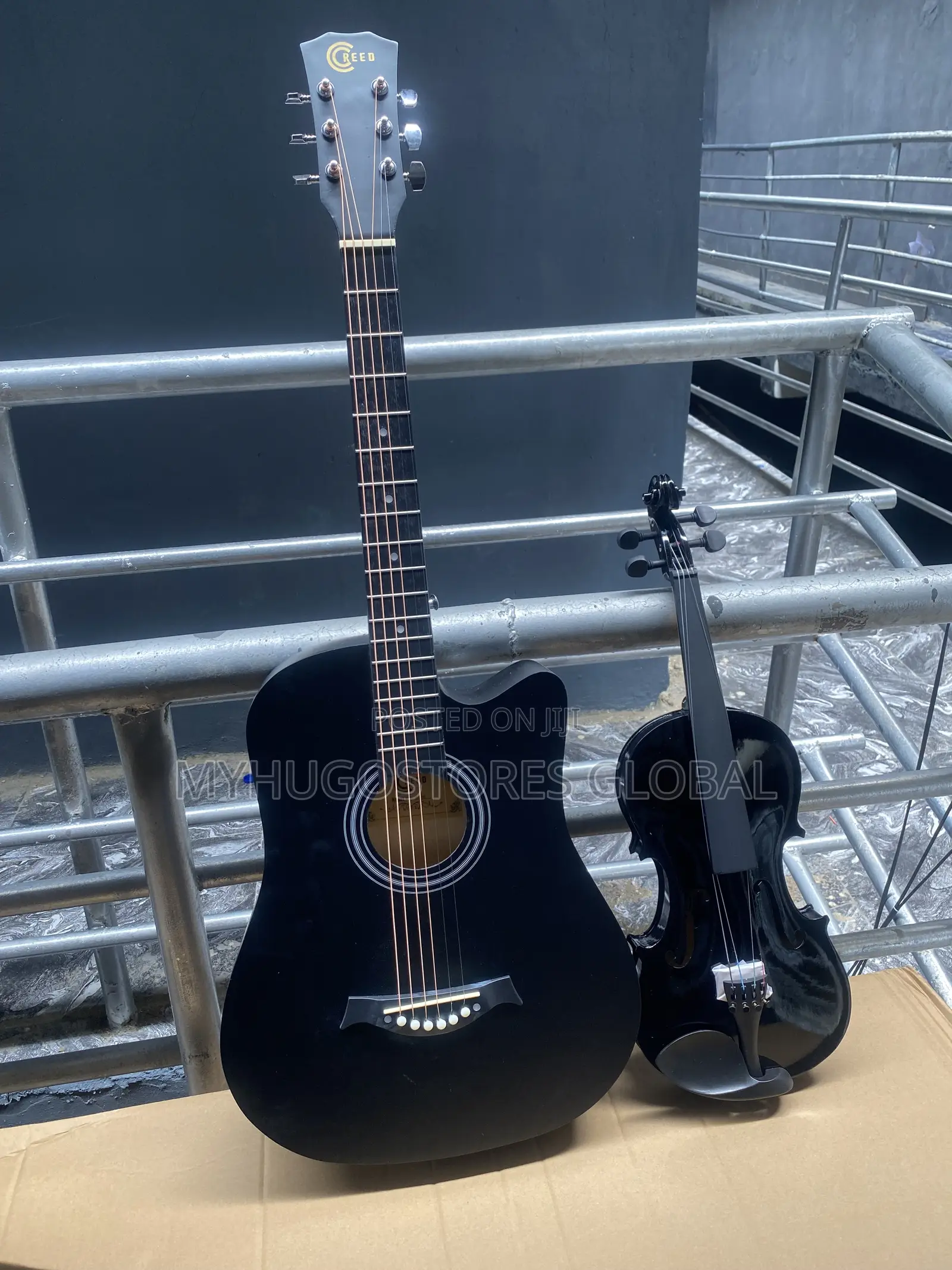 Black Acoustic Guitar and Black Voilin