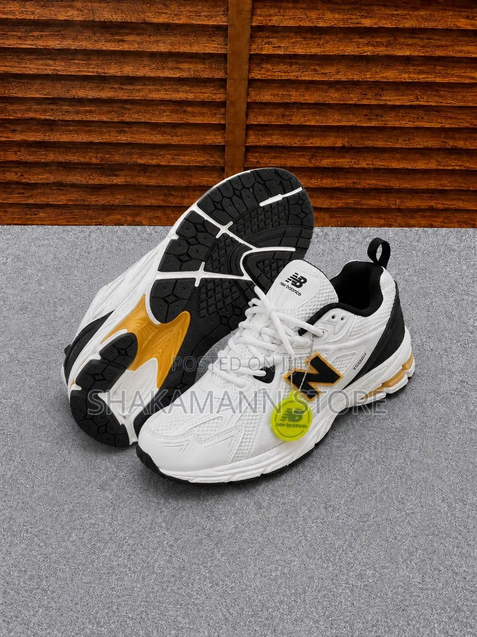 New Balance 1906r Feature White Mesh Upper Gold and Black Accents.