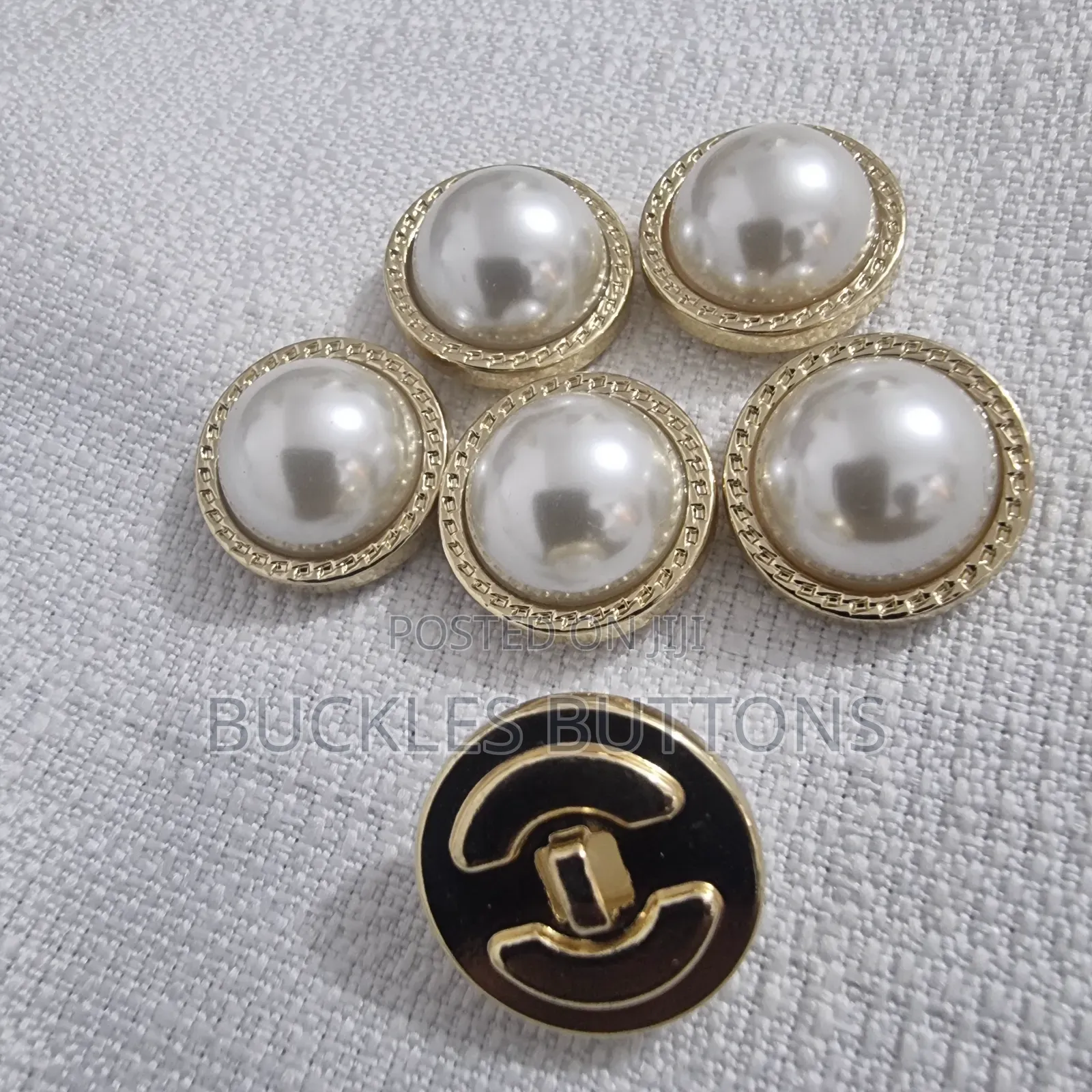 White and Gold Metal Button