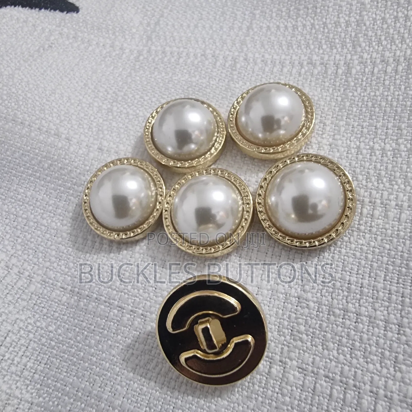 White and Gold Metal Button