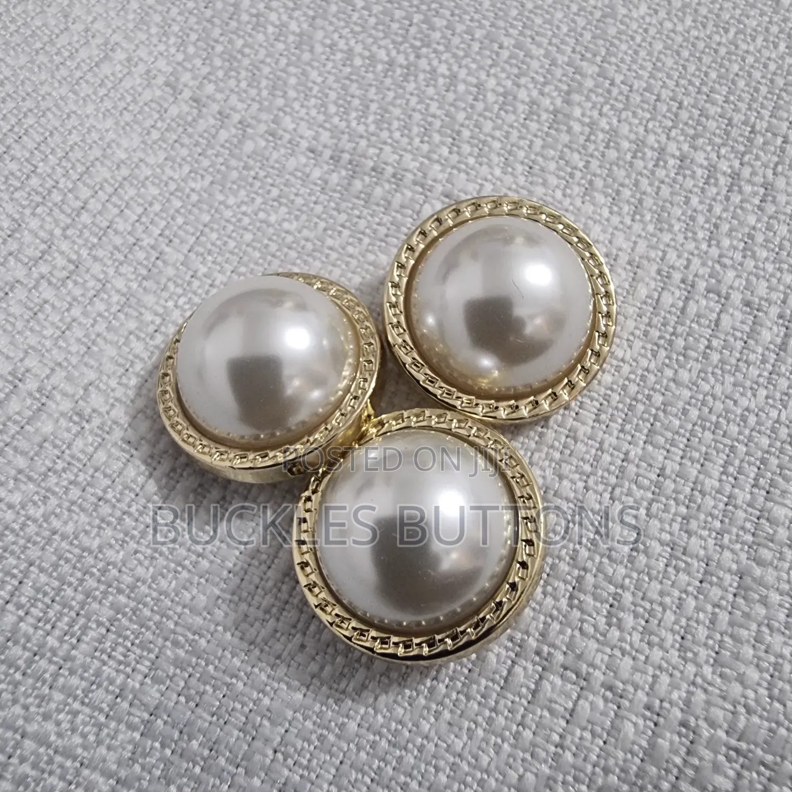 White and Gold Metal Button