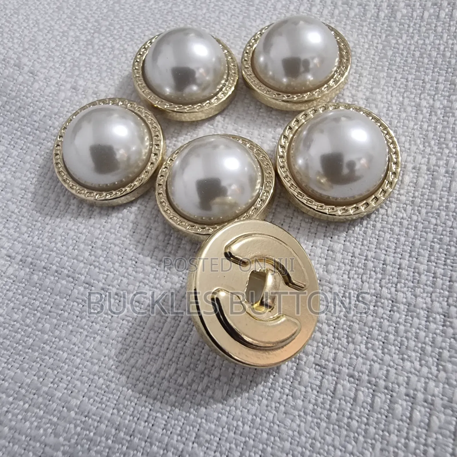 White and Gold Metal Button