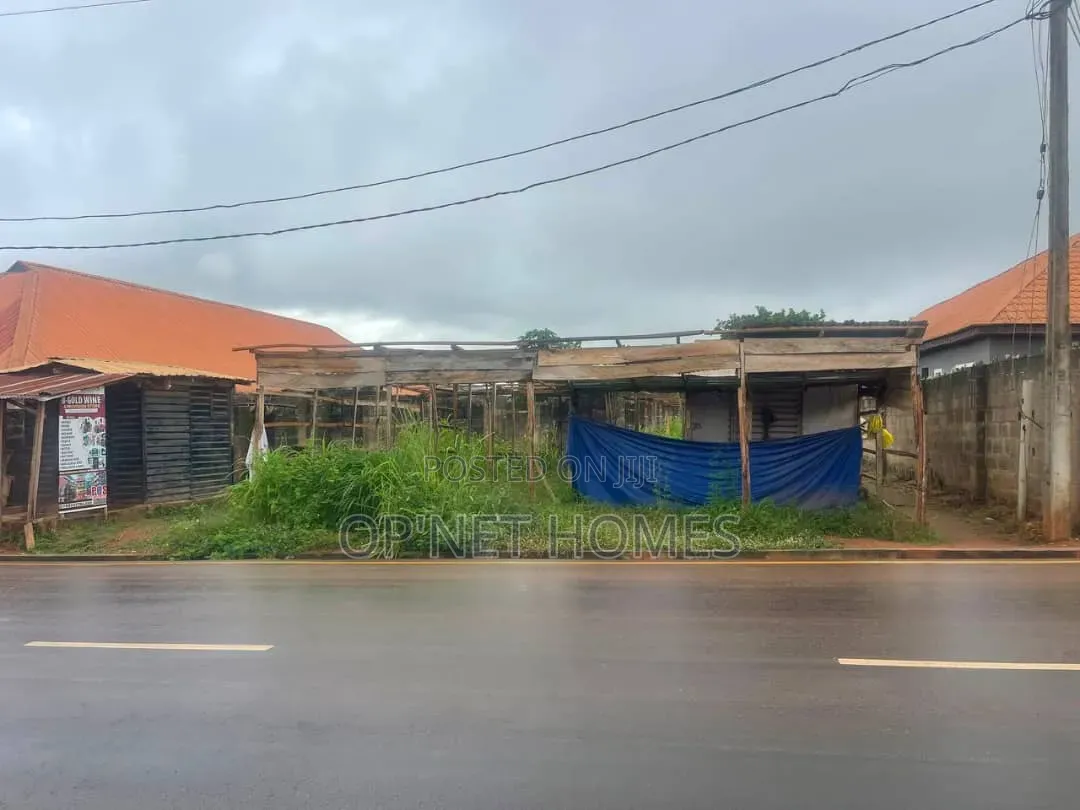 A Plot of Land With an Uncompleted Building Facing a Major Road
