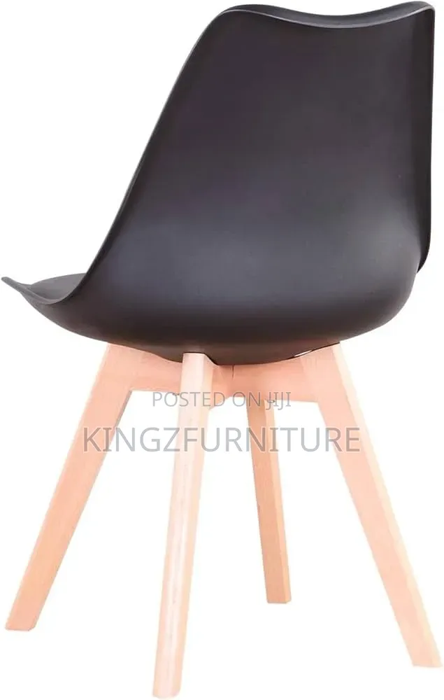 Round White Pedestal Table and Four Matte Black Chairs.