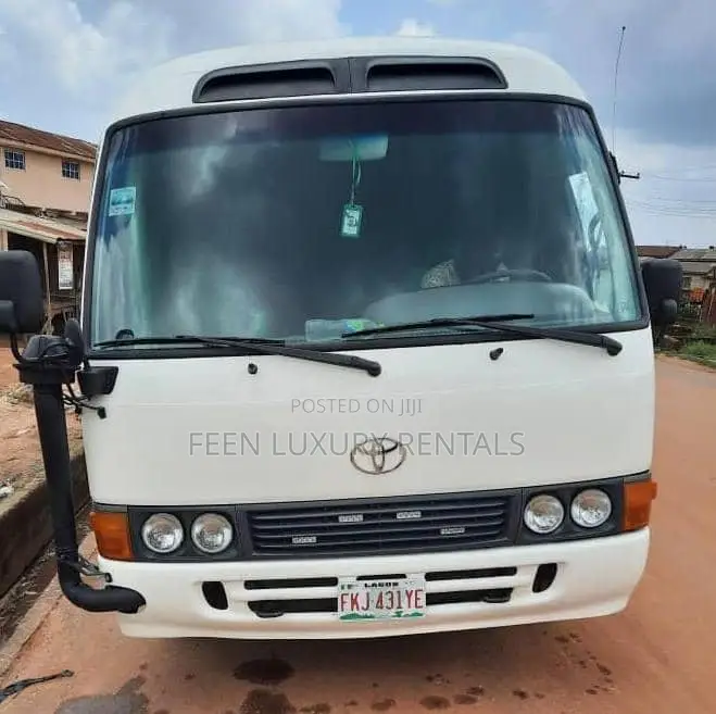 White Toyota Coaster Minibus for Rent | Minibus for Hire