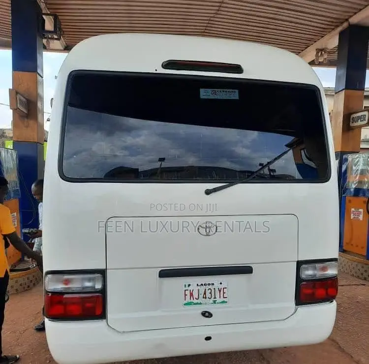 White Toyota Coaster Minibus for Rent | Minibus for Hire