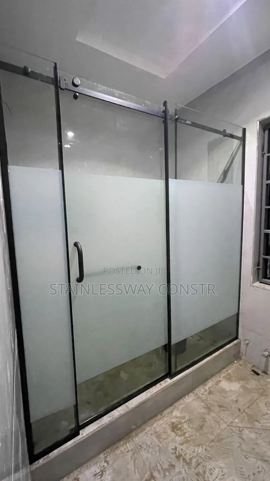 Shower Glass Cubicle With Black Accessories and Middle Frost