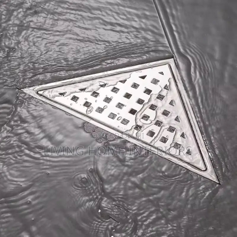An Exploded View of a Triangular Stainless Steel Floor Drain,