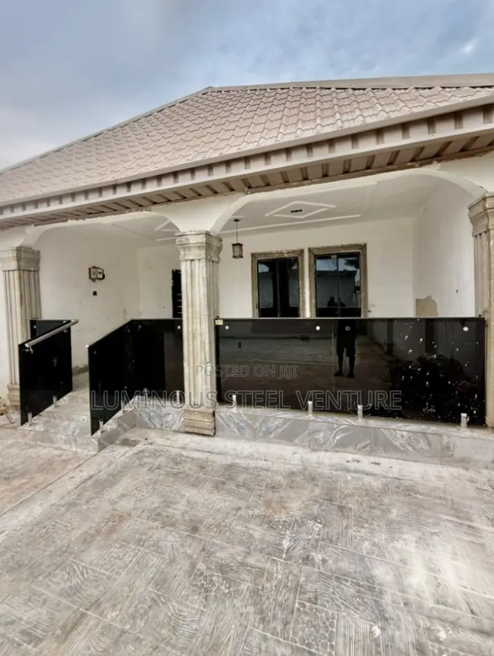 "A Sophisticated Black Glass Balcony Offering a Private, Resort-Like