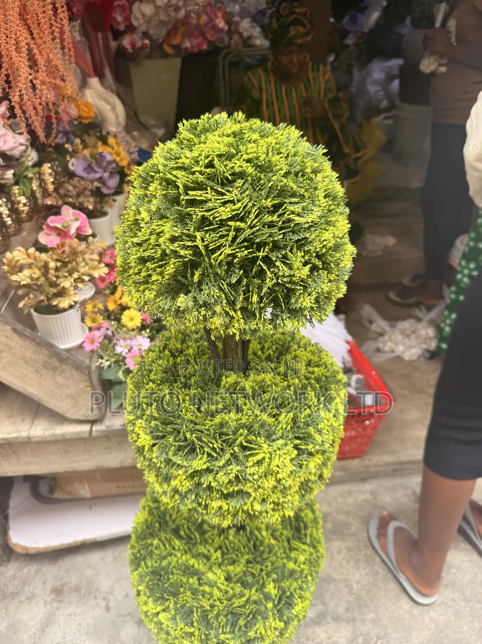 This Artificial Topiary Tree Features Multiple Tiered Green Ball-Shape