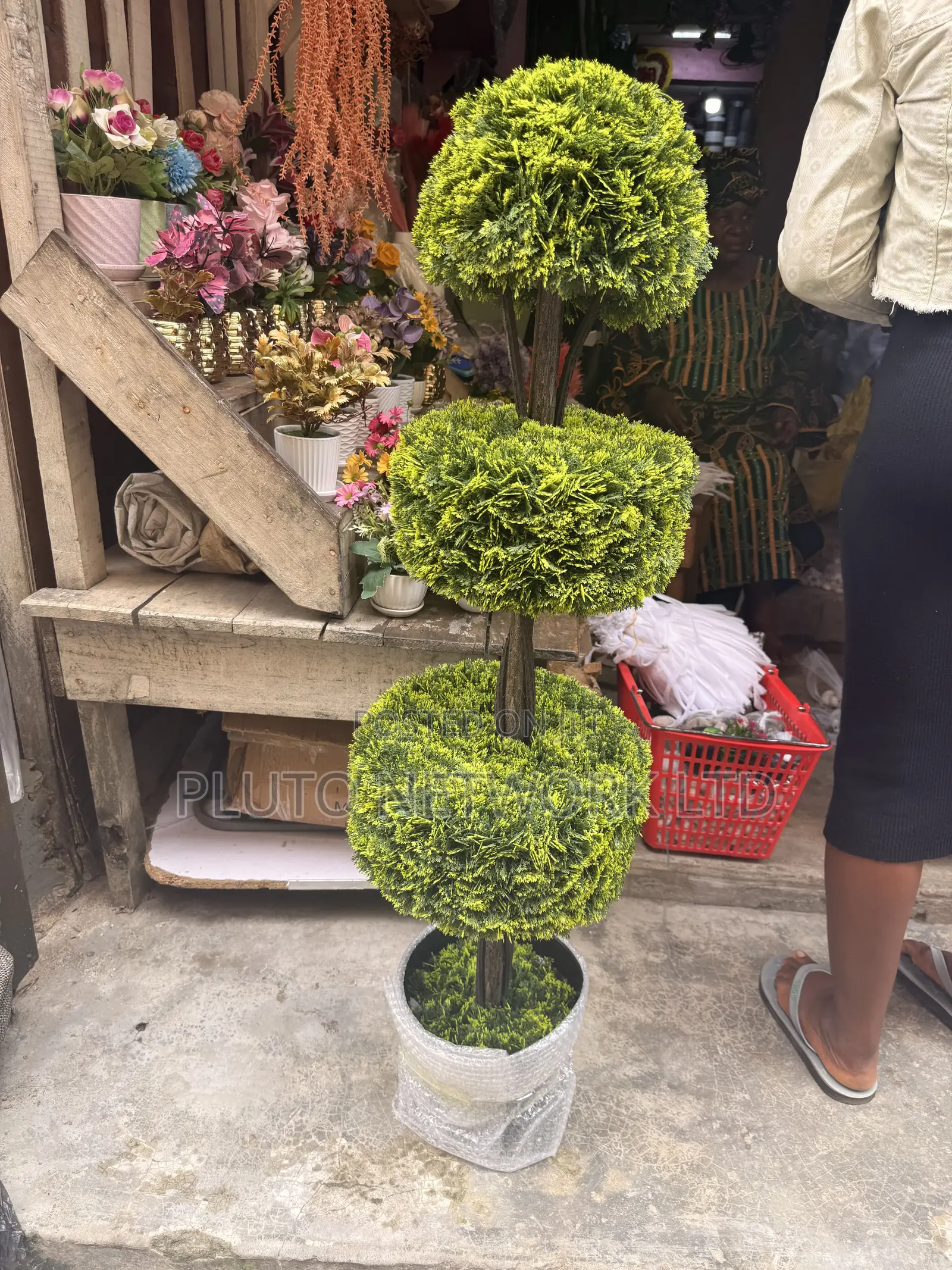 This Artificial Topiary Tree Features Multiple Tiered Green Ball-Shape