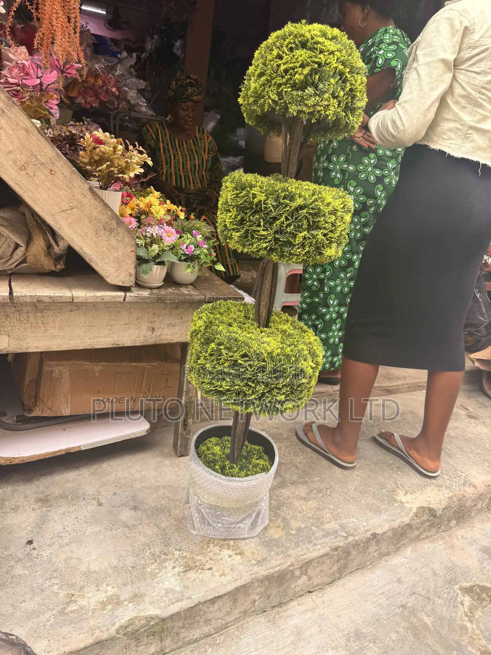 This Artificial Topiary Tree Features Multiple Tiered Green Ball-Shape