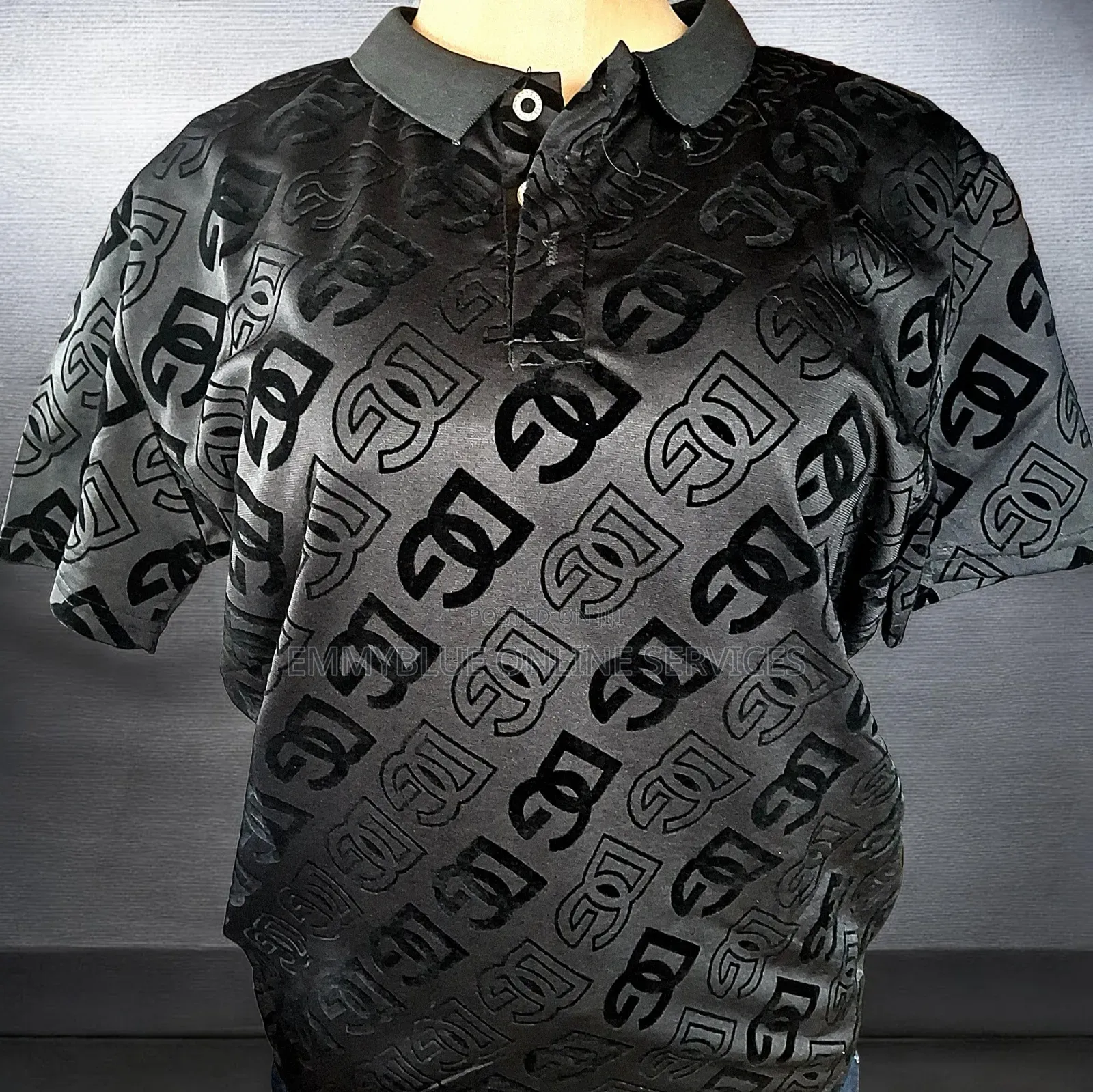 A Black Dolce Gabbana Intarsia Knit Polo Shirt.