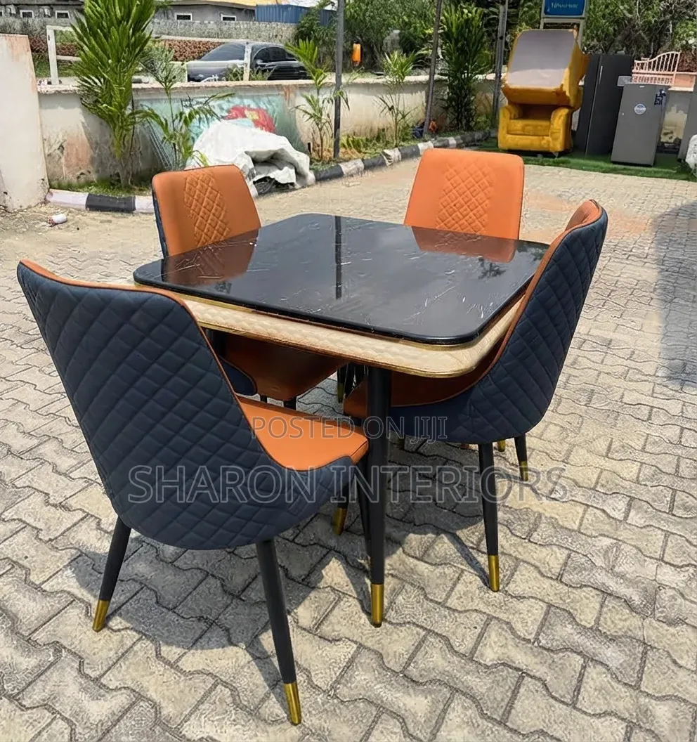 Marble-Top Dining Table With 4 Two-Tone Quilted Chairs.