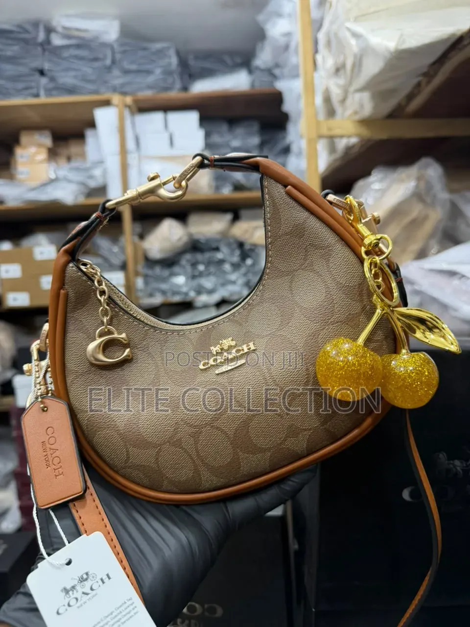 Midi Coach Joine Clutch Bag With a Branded Box