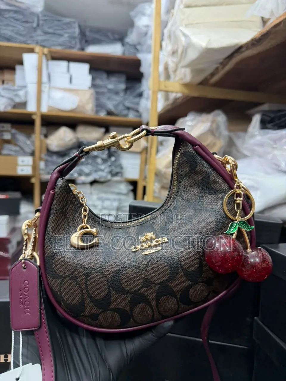 Midi Coach Joine Clutch Bag With a Branded Box