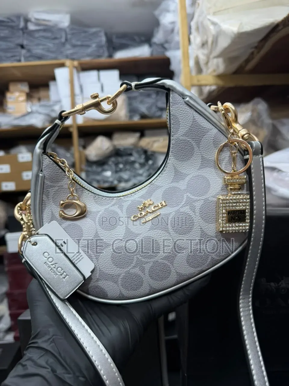 Midi Coach Joine Clutch Bag With a Branded Box