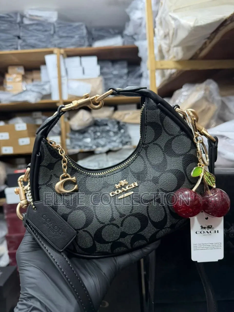 Midi Coach Joine Clutch Bag With a Branded Box