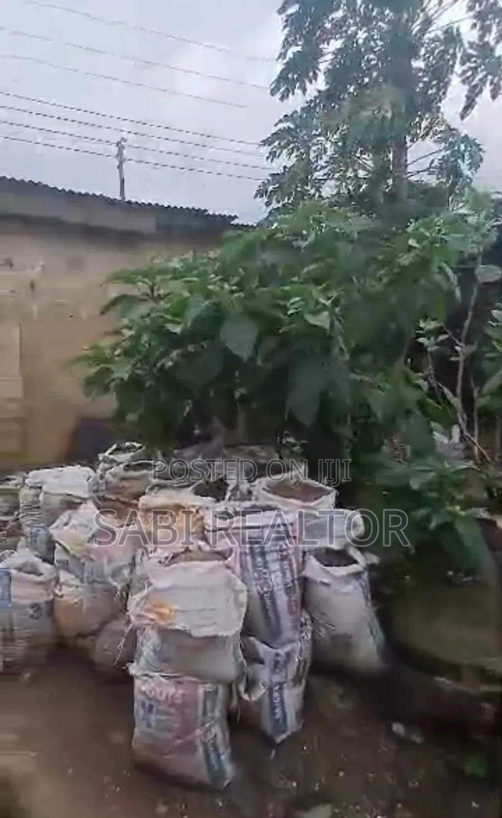 Full Plot of Land With 7 Shop at Adefemi Junction Ipaja Lagos