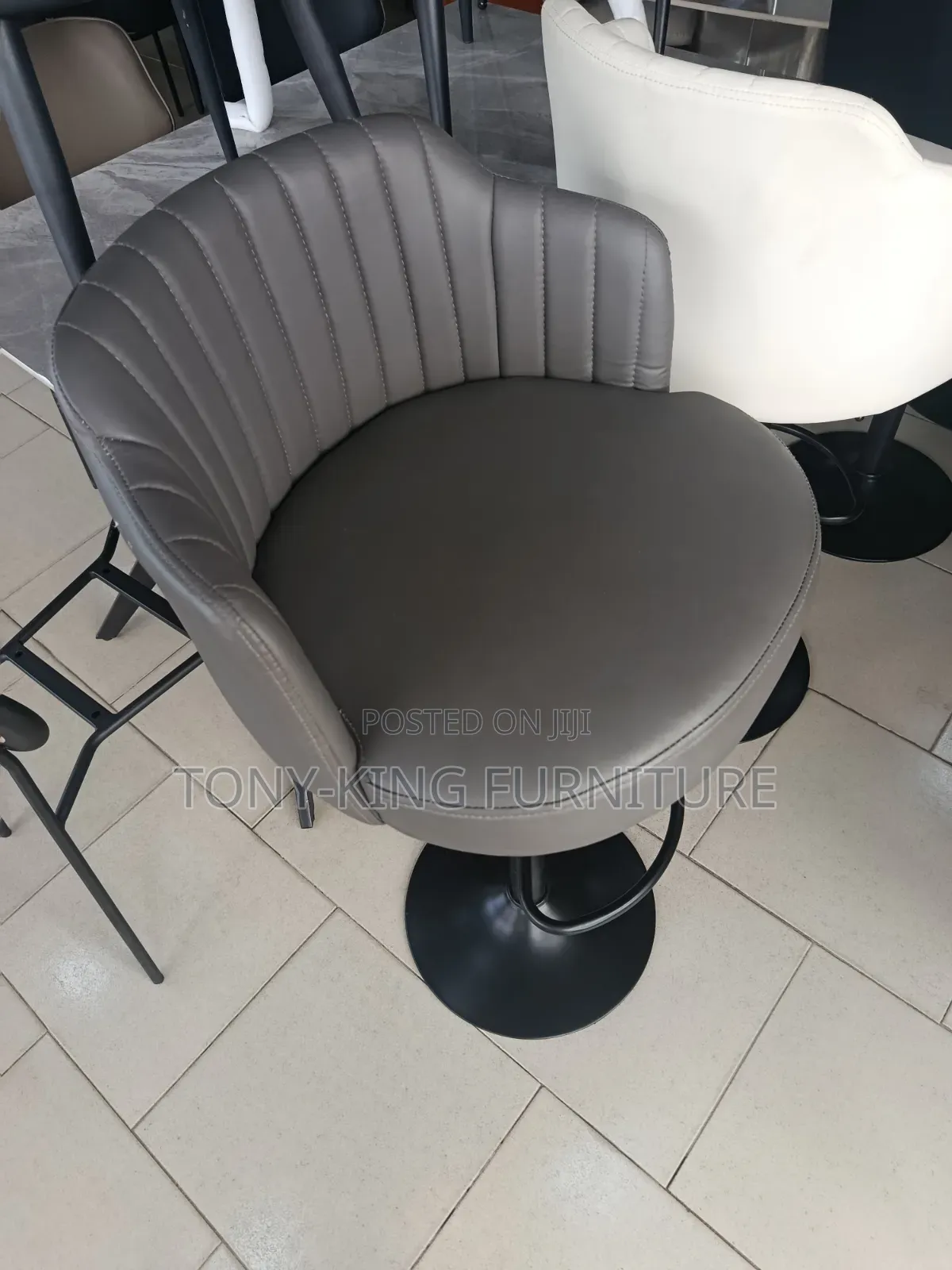 Imported Faux-Leather Bar Stool Features a Modern Swivel Design