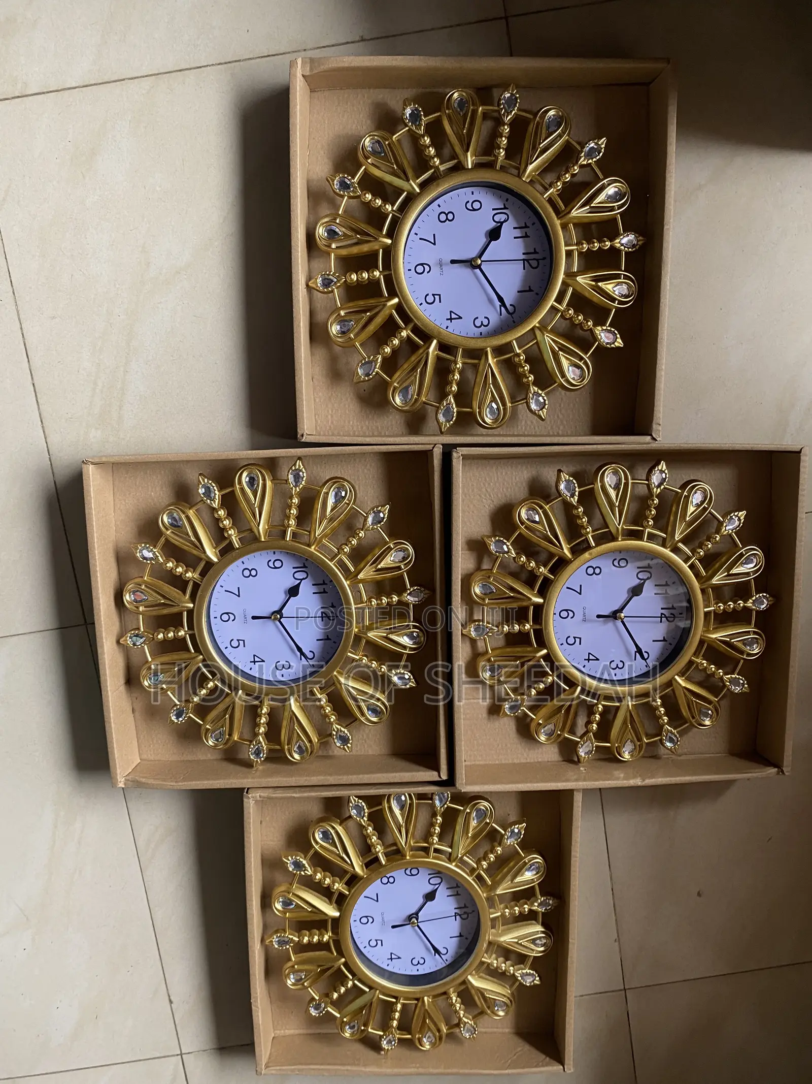 A Decorative Gold Sunburst Clock