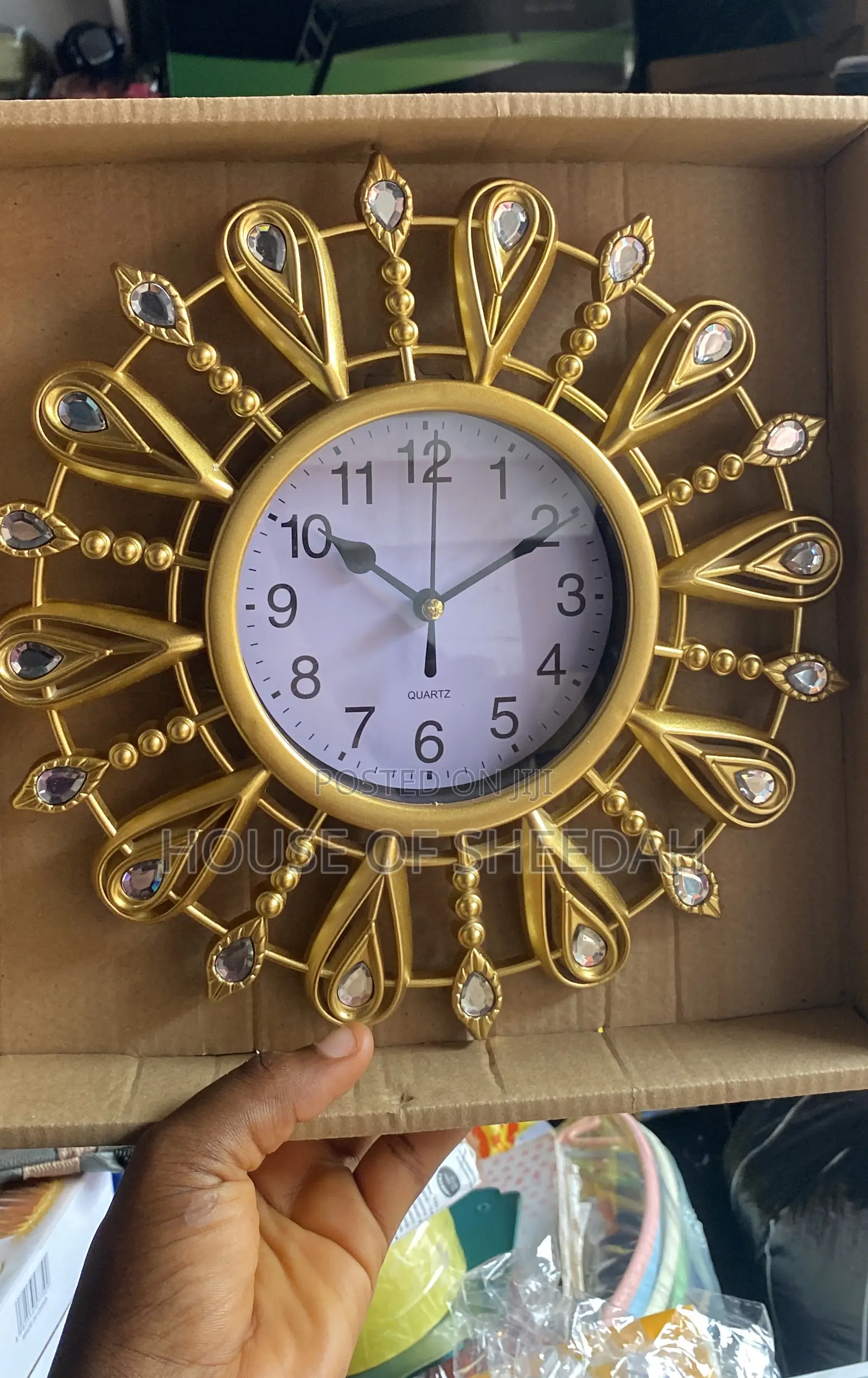 A Decorative Gold Sunburst Clock