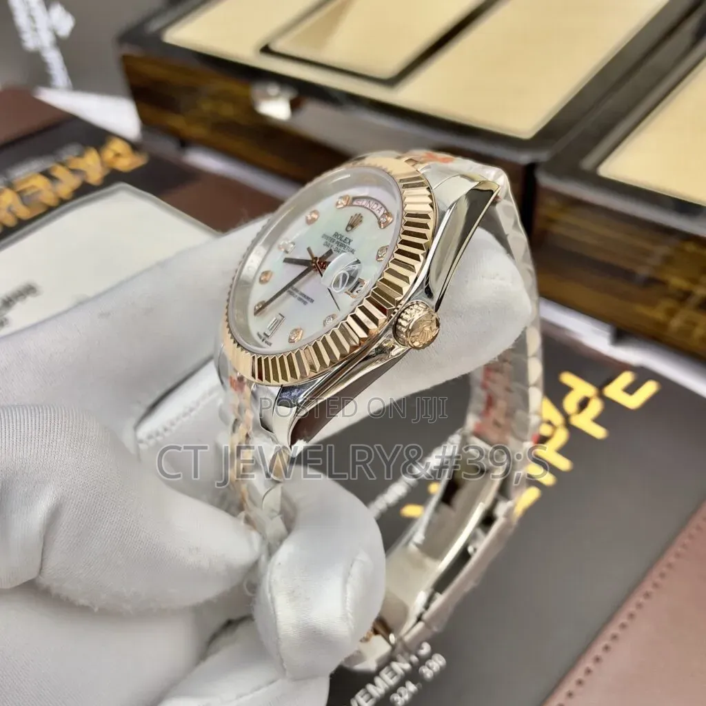 Rolex Day-Date Features a Two-Tone Steel and Rose Gold Diamond Dial.