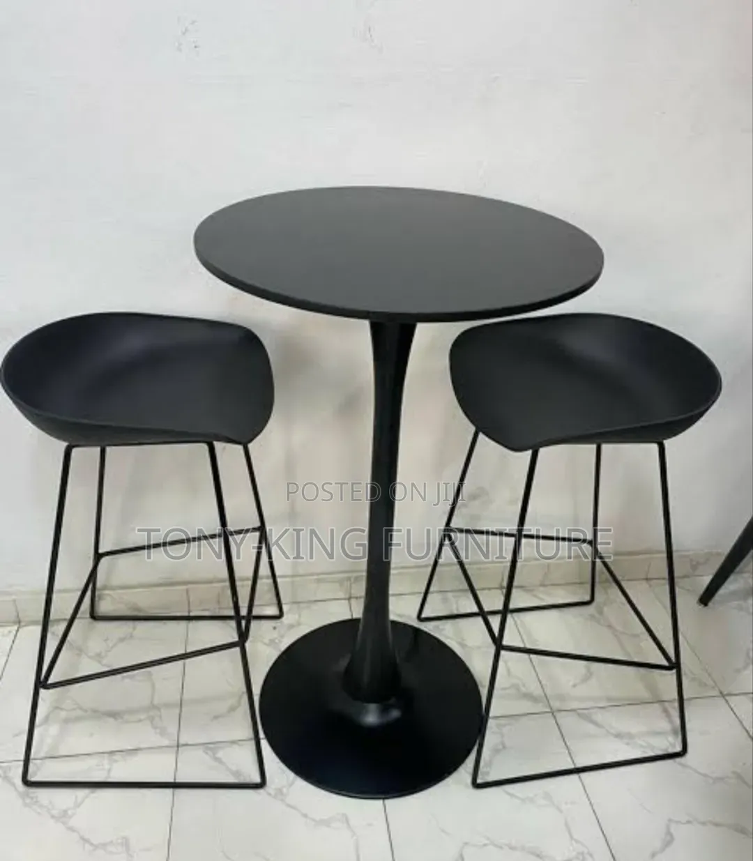 Imported Fiber Stools and a Black Tabletop With a Metallic-Style Base.