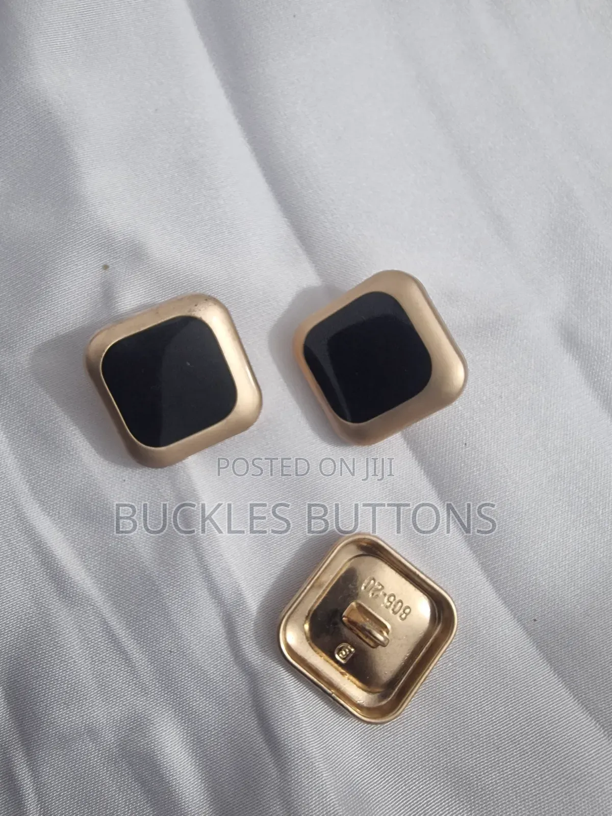 Gold and Black Metal Buttons