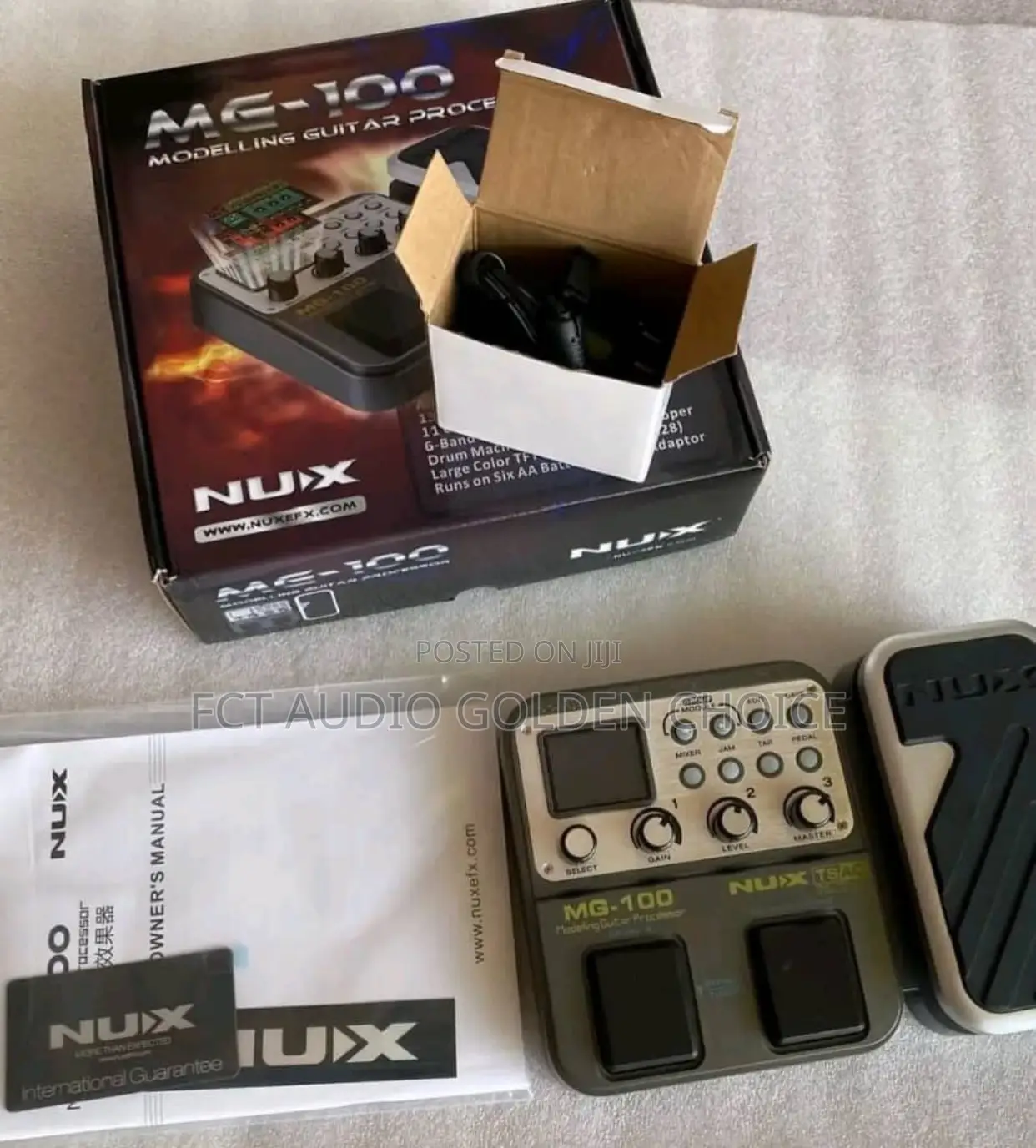 This Is the NUX MG-100 Modelling Guitar Processor .