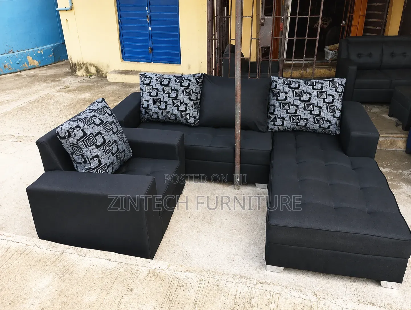 Black L Couch and a Single Seater