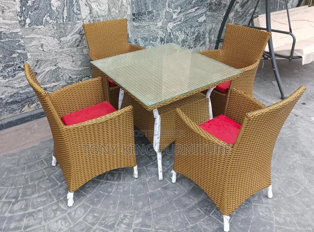 4-Seater Brown Synthetic Rattan Outdoor Dining Set.
