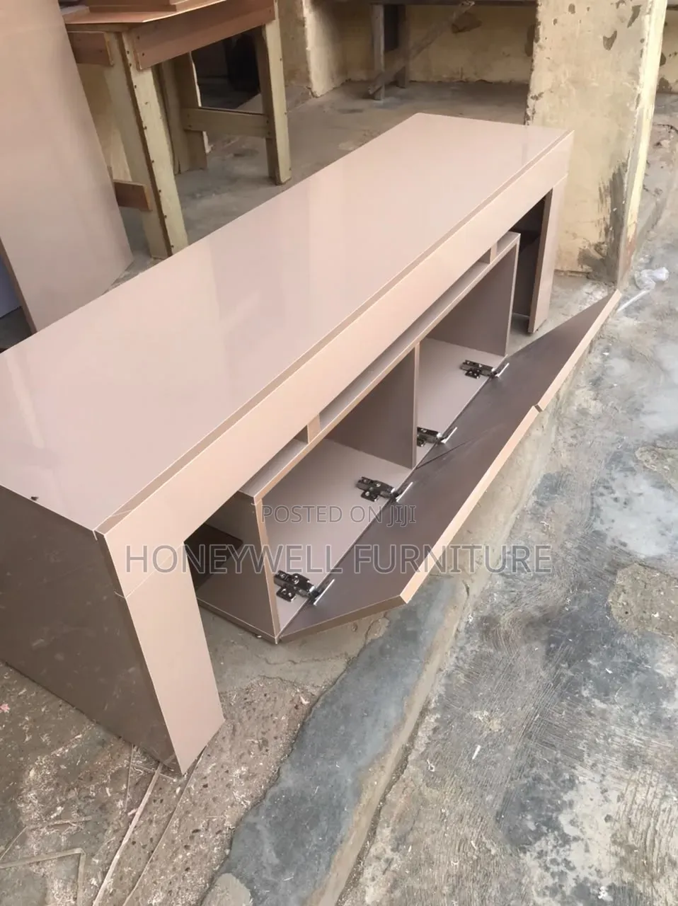 Glossy TV Console With Doors and Glass Shelves on Both Sides