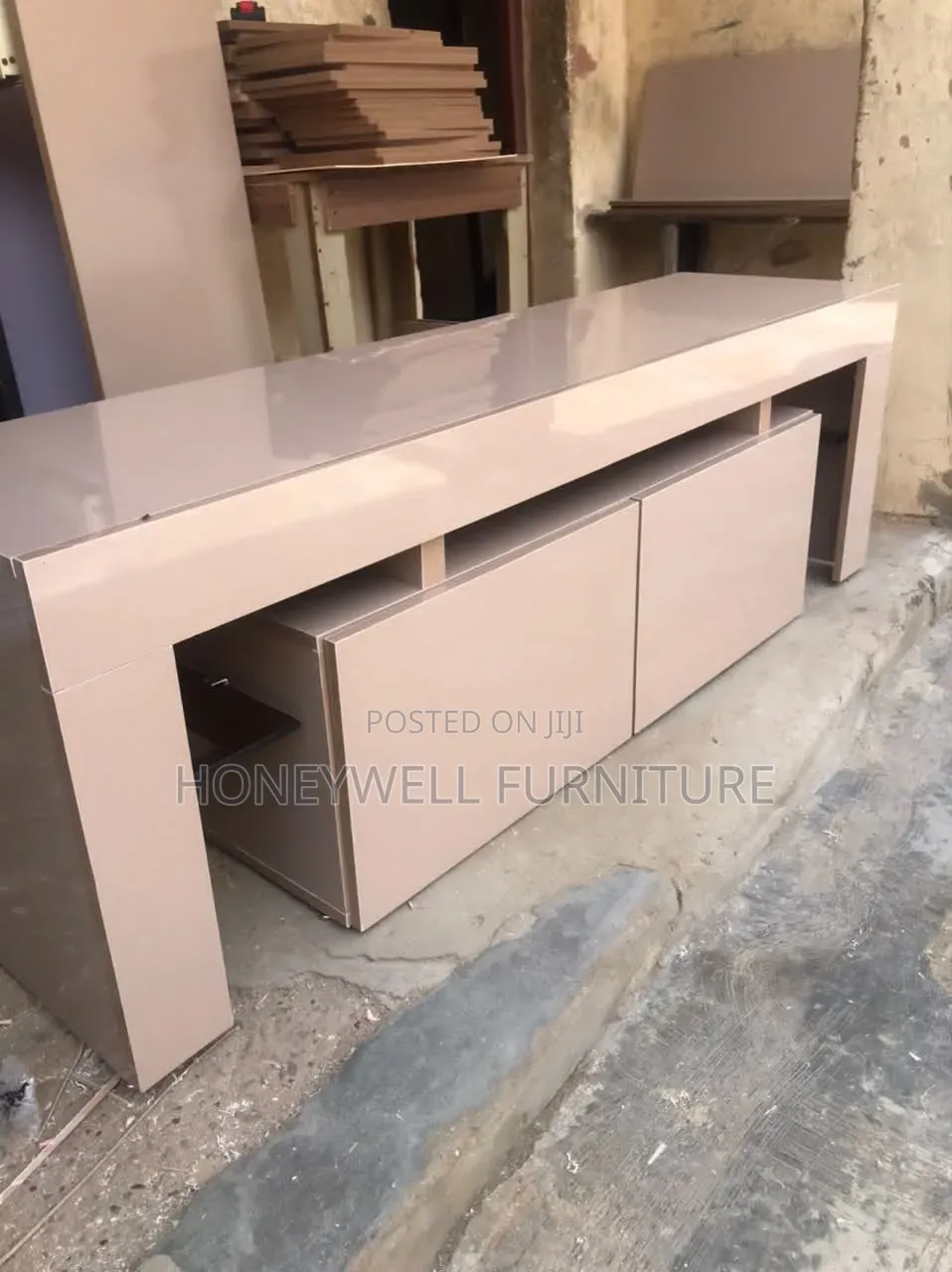 Glossy TV Console With Doors and Glass Shelves on Both Sides