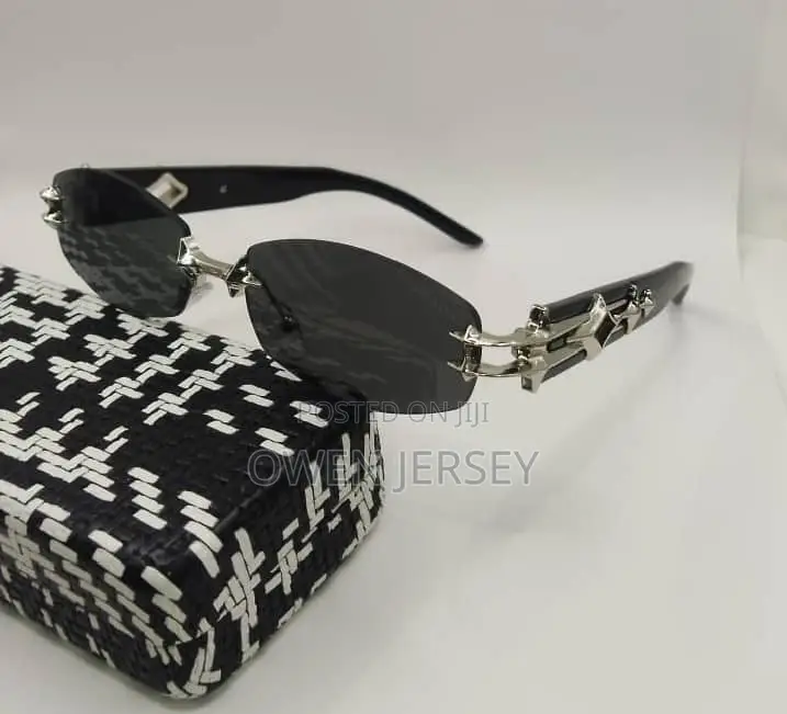 Prada Rimless Sunglasses With Gold-Tone Accents.