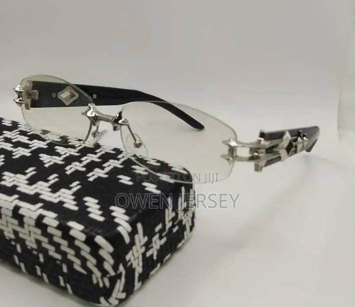 Prada Rimless Sunglasses With Gold-Tone Accents.