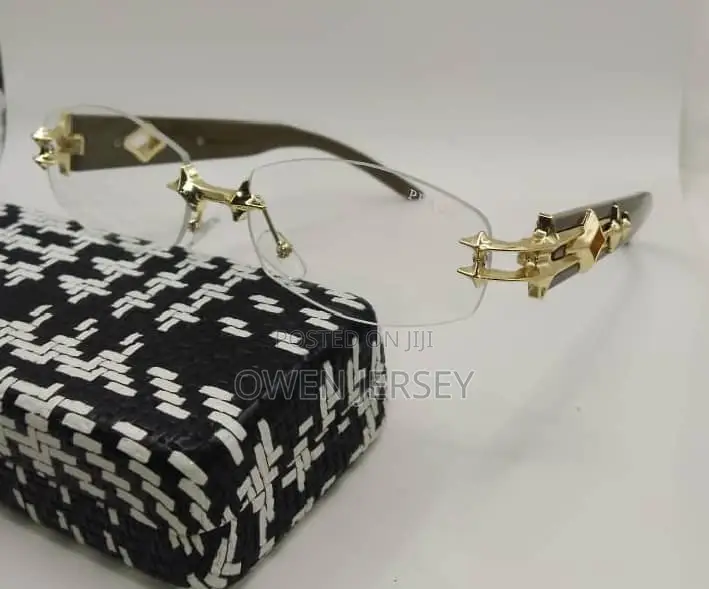 Prada Rimless Sunglasses With Gold-Tone Accents.