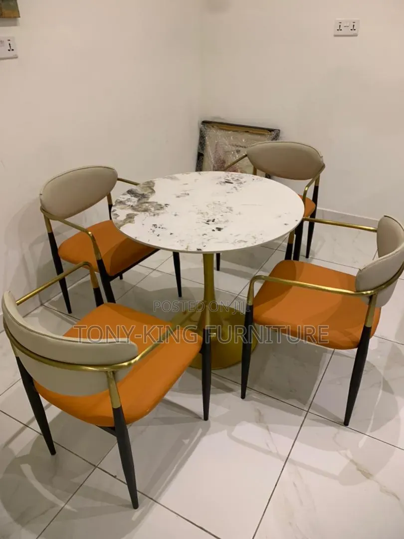 Modern Marble-Top Dining Set Features Vibrant Orange and Cream