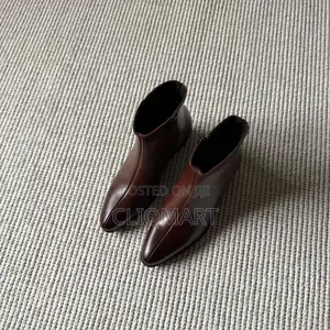 The Heeled Leather Lined Ankle Boot Available in Black and Brown Color