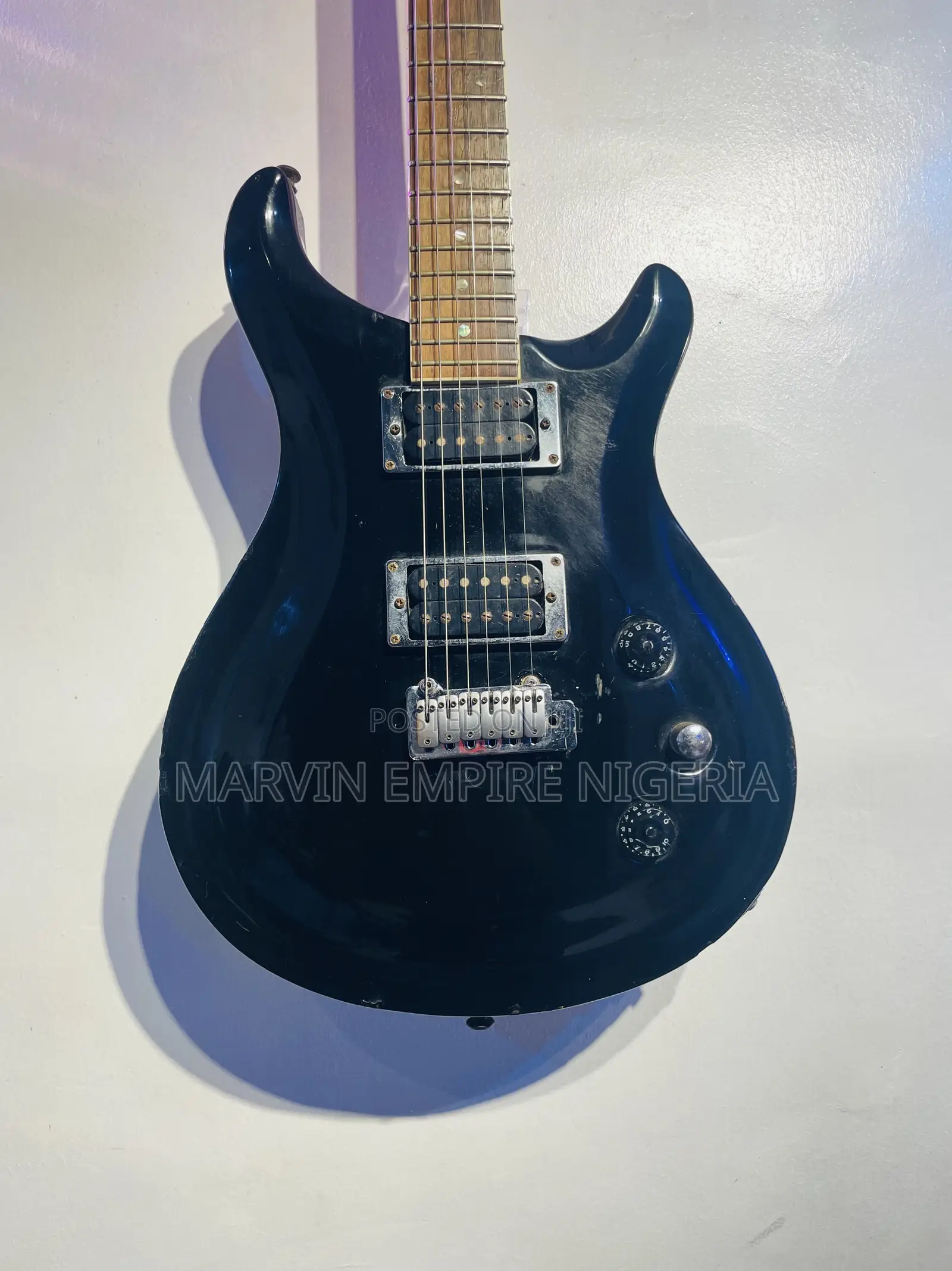 Black Double-Cutaway Jazz Electric Guitar With a Dual Humbucker Pickup