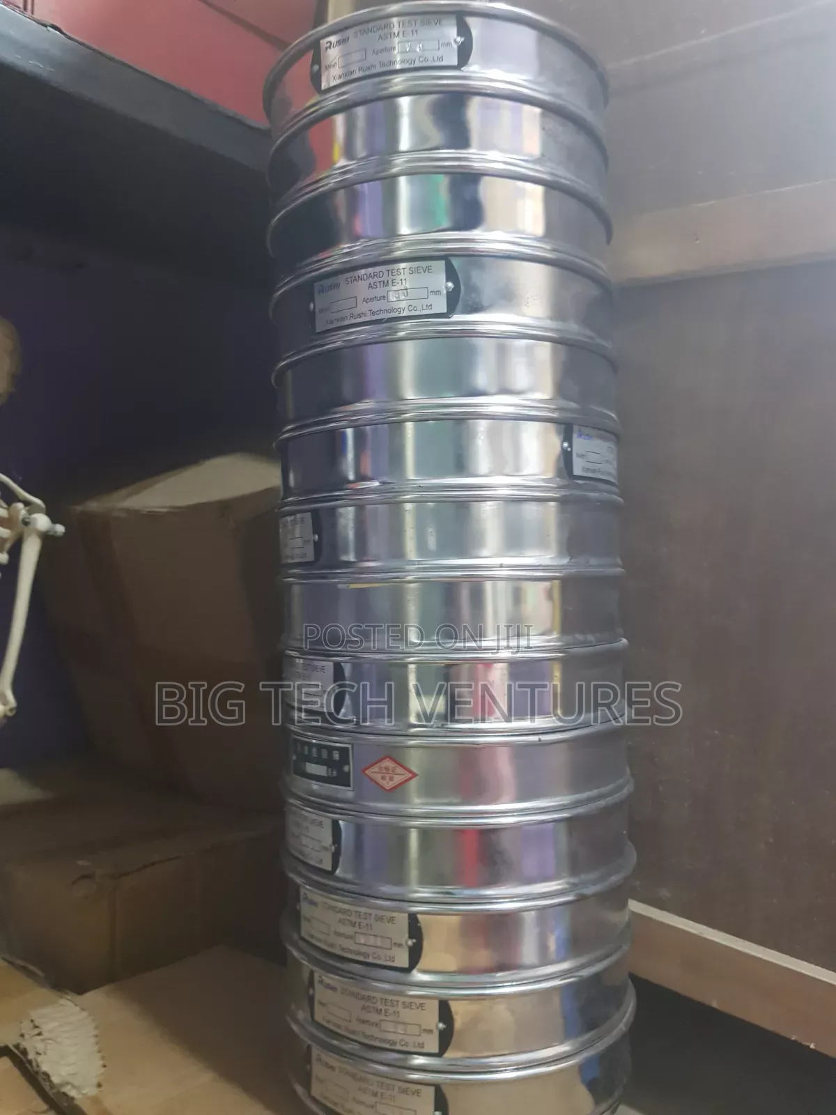 Shows a Stacked Set of Round, Stainless Steel Laboratory Test Sieves