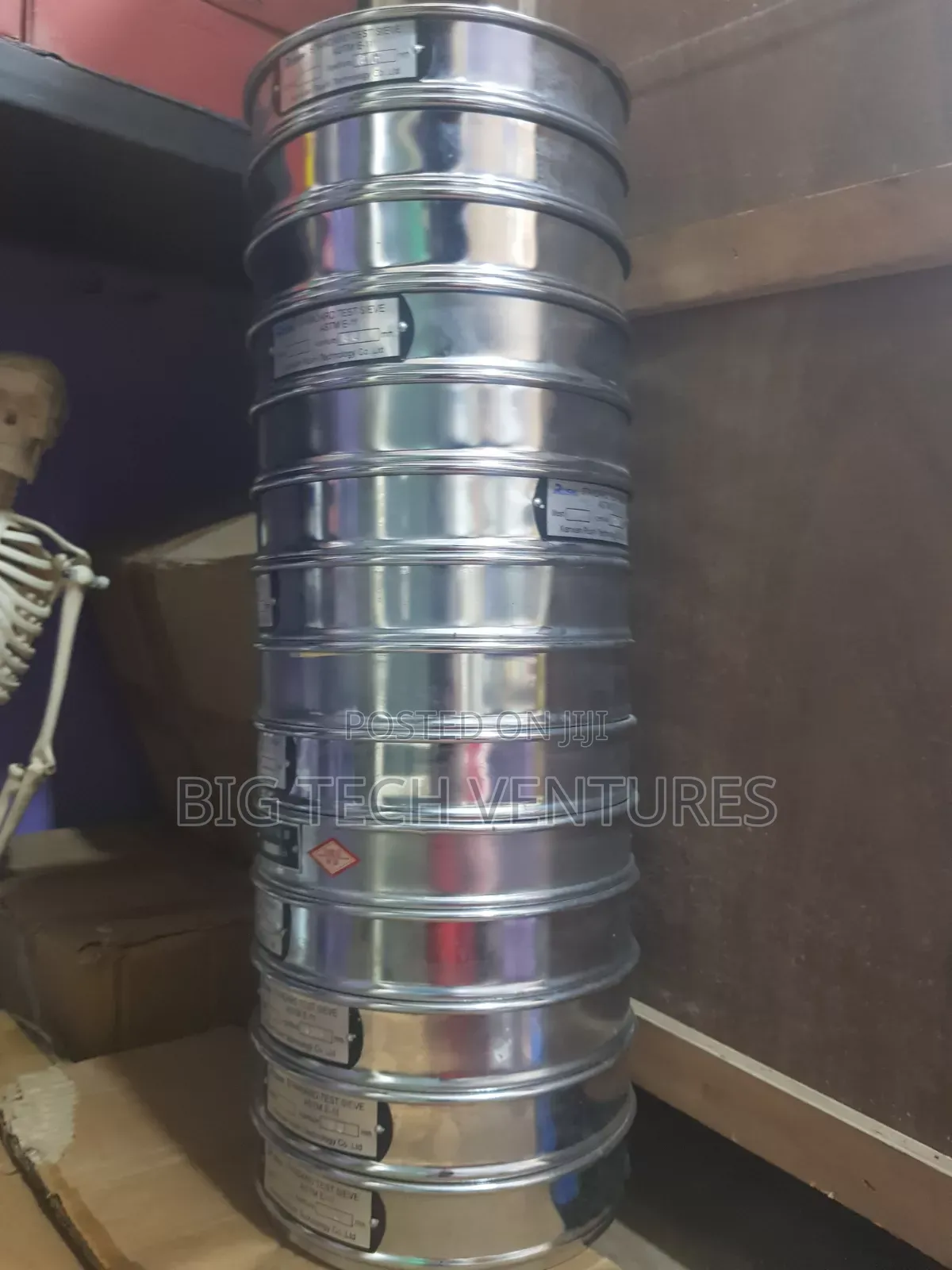 Shows a Stacked Set of Round, Stainless Steel Laboratory Test Sieves