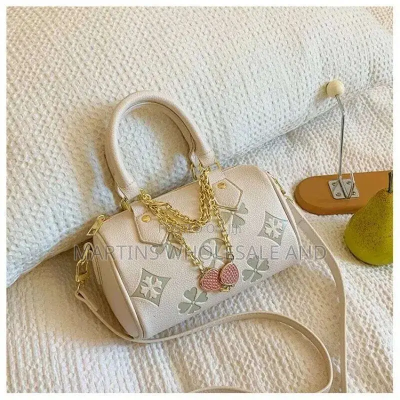 Stylish Faux-Leather Mini Barrel Handbags Feature a Distinctive