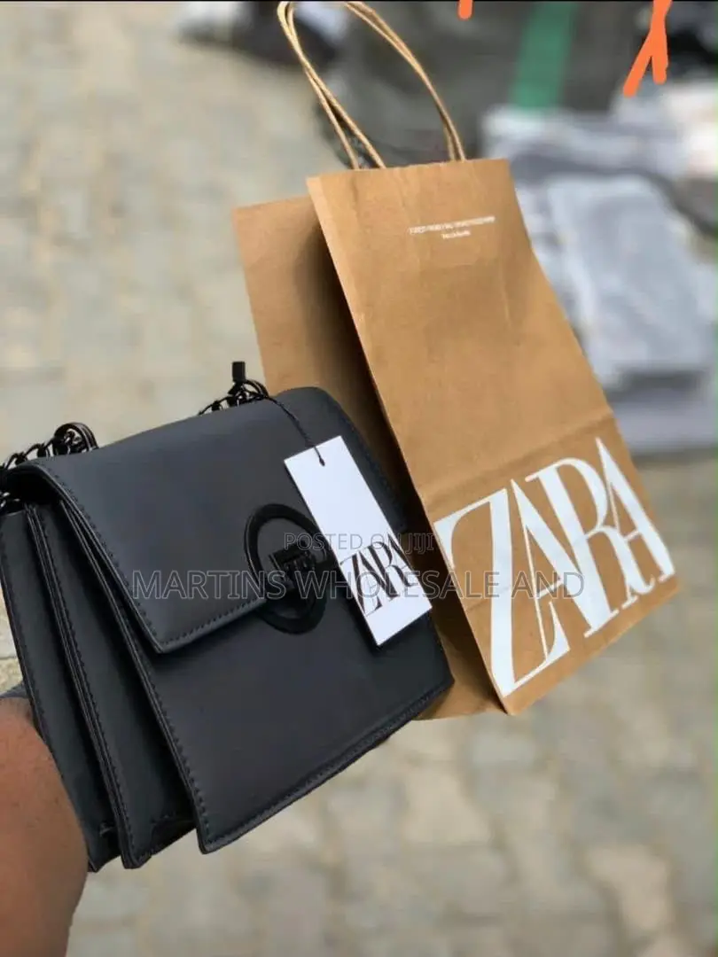 Sleek Black Zara Crossbody Bag Features a Structured Design, a Promine
